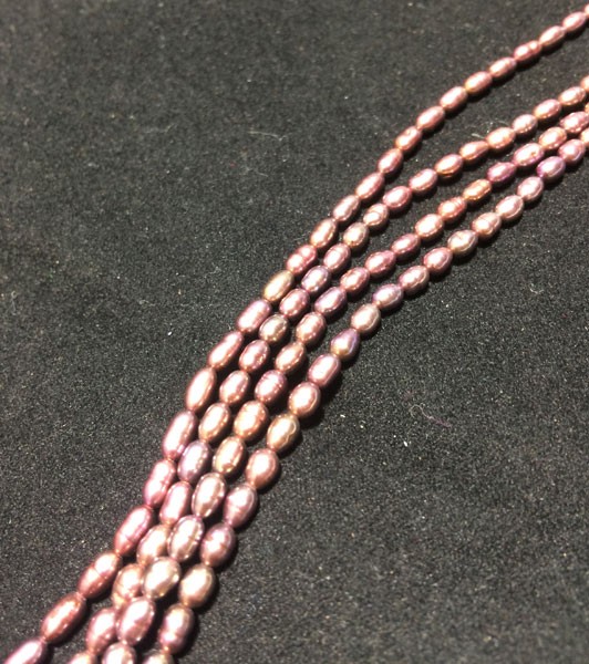 Perla ovalada color burdeo, 2mm