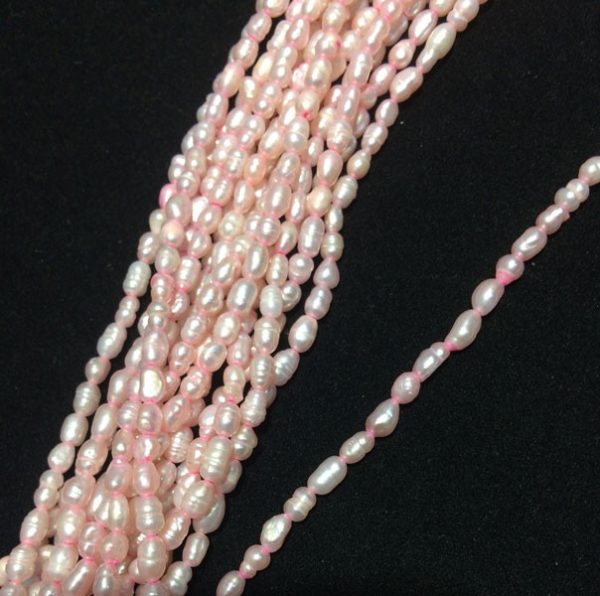 Perla ovalada color rosada, 2mm
