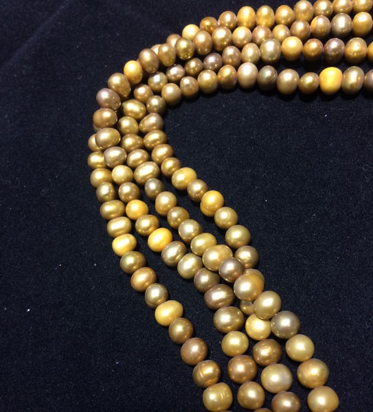 Perla ovalada color mostaza, 6mm