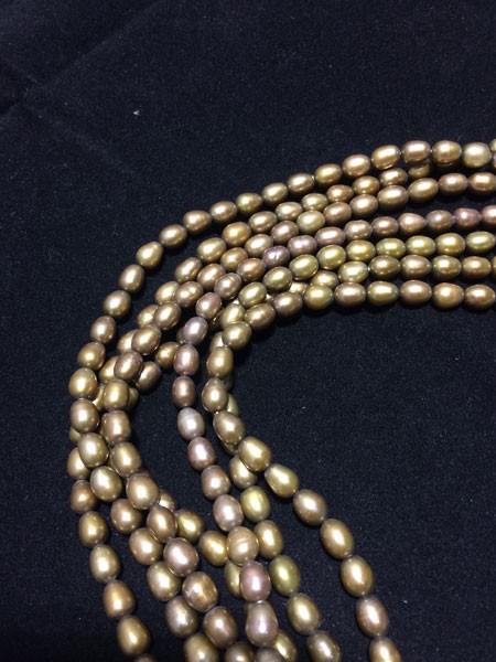 Perla ovalada color mostaza, 5mm